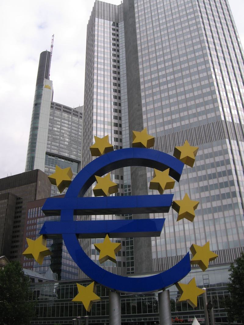The large blue euro sign sculpture in front of the Eurotower in Frankfurt